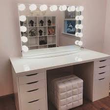 white vanity with mirror and lights