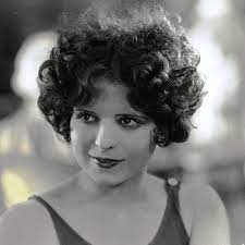 Kiss curls were worn with straight and curly hair alike. 1920s Hair For The Modern Gal Bellatory
