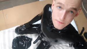 Shiny and Bald Rubber Slaveboy