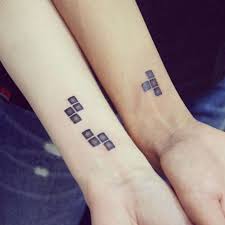 A tetris heart tattoo, i love it.i can't really tell what part of the body it's on, but i'm gonna go ahead and pretend it's not the taint. 1001 Ideas For Couples Siblings And Friends Matching Tattoos