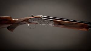 Want to get a gun made specifically for the trap, skeet, or sporting clays range? A Pre Owned 12 Bore Holland Holland Sporting Over And Under Shotgun With 29 Inch Barrels