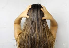 The truth is that you shouldn't get your hair dyed at all if it is dirty. Young Woman Applying Hair Oil With Her Fingers Oiling Hair Before Washing Hair Care Concept Stock Photo Picture And Royalty Free Image Image 137430135