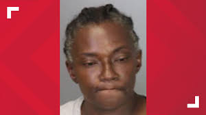 Mom charged with taking man's phone after son made him strip