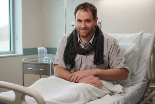 Is Josh Gates hospitalized and what's his current health status?
