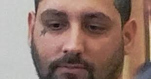 Man accused of robbing gas station employees at gun point