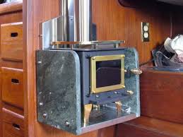 Cubic mini cub wood stove aboard a small sailboat. The Cubic Mini Wood Stoves For Tiny Houses Are Here Cubic Mini Wood Stove Mini Wood Stove Wood Stove
