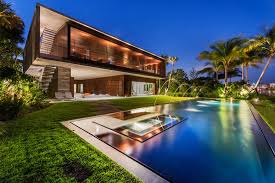 A Luxury Miami Beach Home With Pools Natural Lagoons And A Rooftop Garden Miami Beach House Mansions Pool Houses