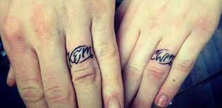 42 Wedding Ring Tattoos That Will Only Appeal To The Most Amazing Of Couples Tattooblend Wedding Band Tattoo Ring Tattoos Tattoo Wedding Rings