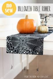 Great for putting a candle in the middle. No Sew Halloween Table Runner With Hanging Spiders From My Book No Sew Love Make It And Love It
