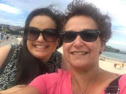 Can someone enhance this old photo of my mum?