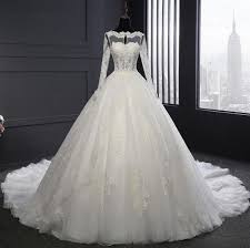 Please complete the form below and i'll get in touch for a brief phone consultation to find out how i can make your dream hawaiian beach wedding a reality. Real Long Sleeve Ball Gown Big Train Bridal Wedding Dress China Wedding Gown And Dress Price Made In China Com