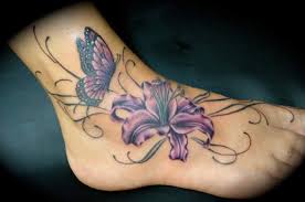 Floating flowers tattoo on foot for girls. 125 Gorgeous Girly Foot Tattoos And Designs