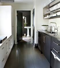 Cozy and comfy, living room and dining space combo, with a kitchen that includes a breakfast bar, easy to clean tile flooring, white cabinets for storage, and all the amenities you need for your everyday cooking experience, laminate floors throughout. Galley Kitchen Contemporary Kitchen Atlanta Homes Lifestyles