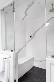 Black And White Marble Floor Bathroom A Round Rain Shower Head Is Fixed To White And Gray Marble Shower Ceiling Over Black Floor Tiles Ending At A Marble Showers White Marble Shower Shower Ceilings
