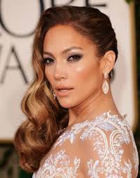 Use a gel or wax to brush the hair onto the bun and fasten it securely with a band. Jennifer Lopez Long Hairstyles Side Waves Hair Popular Haircuts Hollywood Hair Old Hollywood Hair Jennifer Lopez Hair