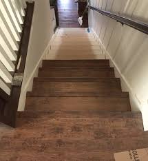 Start installing the floor at the top of the stairs. Stairway Makeover Swapping Carpet For Laminate The Lilypad Cottage