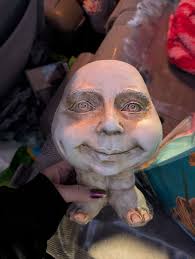 Got this at a thrift store yesterday it's resin I thought it was cute it's  a planter