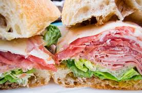 The sandwich consists of a long roll that resembles italian bread, but the interior is much chewier and the exterior is crustier. Man Food Meaty Sandwich Perfection At Coppa