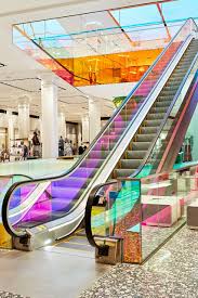 Oma Adds Iridescent Glass Escalator To New York S Saks Fifth Avenue Mall Design Shopping Mall Interior Architecture