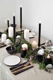 Gold and white geometric tablescape wwith lots of candles. A Scandinavian Inspired Christmas Table Setting Holiday Table Decorations Christmas Decor Inspiration Scandinavian Christmas Decorations
