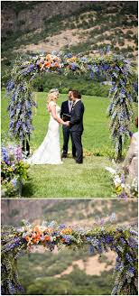 Beautiful Flower Arch Floral Arbor Blue And Purple Snapdragons Orange Flowers California Wedding Red Wedding Flowers Purple Wedding Theme Wedding Backdrop
