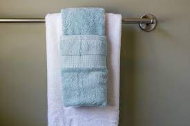 This seems to be the preferred and most classic towel hanging option. How To Display Towels Decoratively Hunker Bathroom Towel Decor Hanging Bath Towels How To Hang Bathroom Towels Decoratively