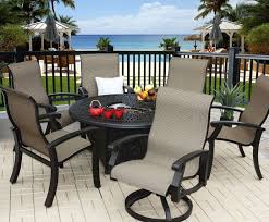 The aroma of delicious food lingering in the air, a soft breeze cooling the table… perhaps you have the fire pit beside you, and it's crackling away. Barbados Sling Outdoor Patio 7pc Fire Pit Set With 52 Round Fire Pit Series 2000 Includes 2 Swivel Rockers 4 Dining Chairs Burner Antique Bronze Finish Zenpatio