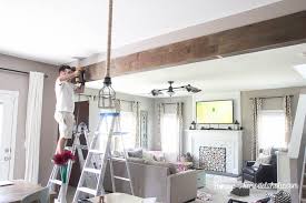 Timber headers for windows, doors, and garages, like so many other ornamental architectural features, help define both the interior style and exterior curb appeal of a home. Remodelaholic Diy Wood Beam Doorway
