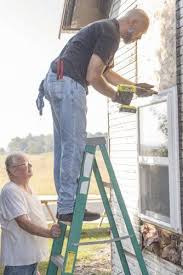 Community members repair Twelve Mile veteran's home