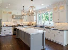 Dark brown shaker bathroom cabinets. Faceted Light Pendants Transitional Kitchen Blue Water Home Builders