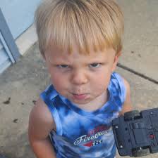 A pedestrian passes by a mural of former Green Bay Packers linebacker Ray  Nitschke