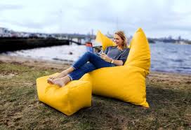 Bright Yellow King Bean Bag With Footstool Used As An Upright Chair Bean Bags For The Outdoors Bean Chair Bean Bag Yellow Furniture