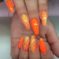 Neon orange nails, undoubtedly, have their allure. Solin Sadek On Instagram Neon Orange Med Orange Glitterombre Coffin Nails Designs Orange Nails Orange Acrylic Nails