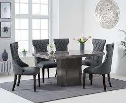 The contemporary styling of these table and chair sets combines a smooth and sleek wood table with chairs in wood with soft upholstered seats. Grey Marble Dining Table With 6 Modern Chairs Homegenies