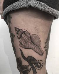 Seashell tattoos are admired by people who have love for oceans, beaches and all things in it. Sea Shell Tattoo By Tattooist Spence Zz Tattoo Tattoogrid Net
