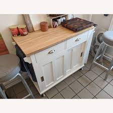 It features fluted corner posts, ornate undertop brackets, a full base. Crate Barrel Belmont White Kitchen Island Aptdeco