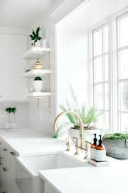 stacked white floating shelves with