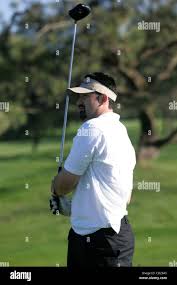 November 14, 2008, San Diego , CA,-.Padre ADRIAN GONZALEZ and sportscaster  JIM STONE hosted the annual golf benefit for the South Bay YMCA at Torrey  Pines south course. Here GONZALEZ watched a