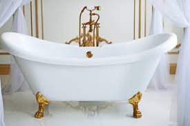 The windows surrounding the tub provide natural lighting for the room. Learn About The History Of The Clawfoot Bathtub