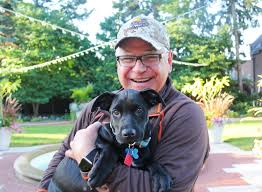 I know what you're thinking: "But does he have a dog?" Meet Scout, a  part-lab rescue who once locked himself in the master bedroom and another  time ate his dad's glasses. Walz's