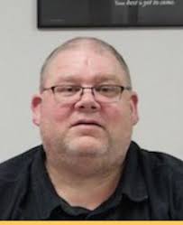 School board member Helle resigns via text message