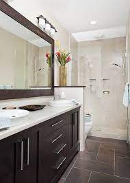 Customize a restaurant wall with a striking mosaic design. Herringbone In Master Eclectic Bathroom Brown Tile Bathroom Brown Bathroom