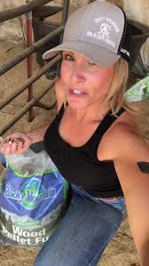 Girl Us Using Reciprocating Saw to Cut Wood Pellets with