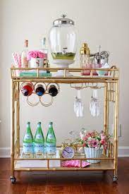 These decor pieces, as trendy get in the holiday spirit! Literally Just 29 Of The Prettiest Bar Carts We Ve Ever Seen Bar Cart Decor Bar Furniture Spa Decor