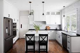 Antique white and espresso dark cabinets juxtaposed to the marble tops create together a fantastic refined appeal. Black And White Kitchen Hillsboro Contemporary Kitchen Portland By Adapt Design Llc Houzz