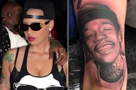 Even his face and the back of his hands were not spared. Wiz Khalifa Looks Extremely Baked In Amber Rose S New Portrait Tattoo Celebrity News Zimbio