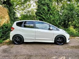 Used 2013 honda fit sport with usb inputs, tire pressure warning, rear bench seats, audio and cruise controls on steering wheel honda sport with polished metal metallic exterior and black interior features a 4 cylinder engine with 117 hp at 6600 rpm*. 2013 Uk Honda Jazz Sport Stock Wheel Refurb In Gloss Black Love This Car Hondafit