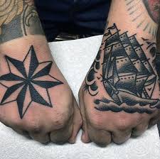 Black tribal star tattoos on left half sleeve. 80 Nautical Star Tattoo Designs For Men Manly Ink Ideas Star Tattoos Star Tattoo Designs Tattoo Designs Men