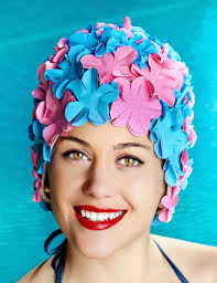 Rubber bathing caps in swimming pools during the 50's, 60's, and 70's
