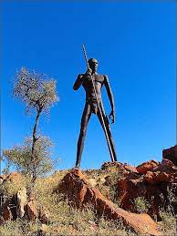 Local sculptor, mark egan, based him on a traditional man from the local anmatjere tribe, and worked on him for a year before he was erected in 2005, attracting people to stop at the roadhouse underneath him. Anmatjere Man Airelon Sculpture Nt The Stone Family In Australia